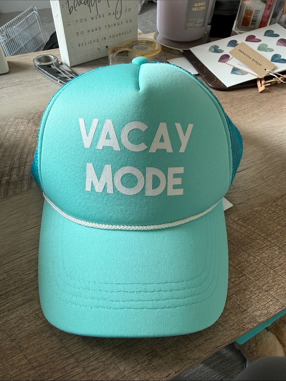 Buckle Vacay Mode Trucker Hat in Aqua with White Text